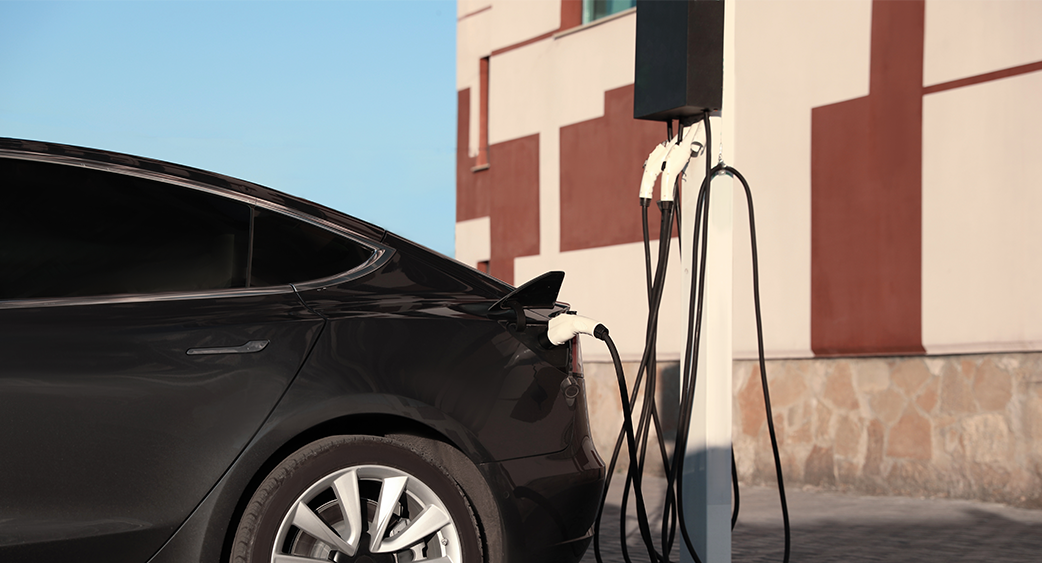 Power Grid Power Lines above city at dusk