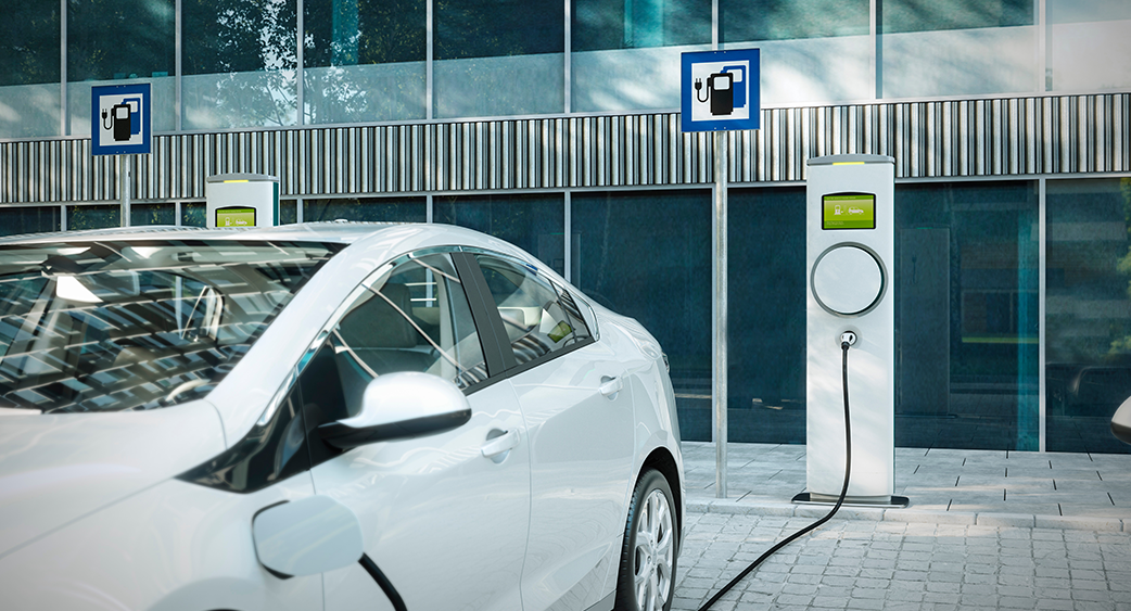 Power Grid Power Lines above city at dusk